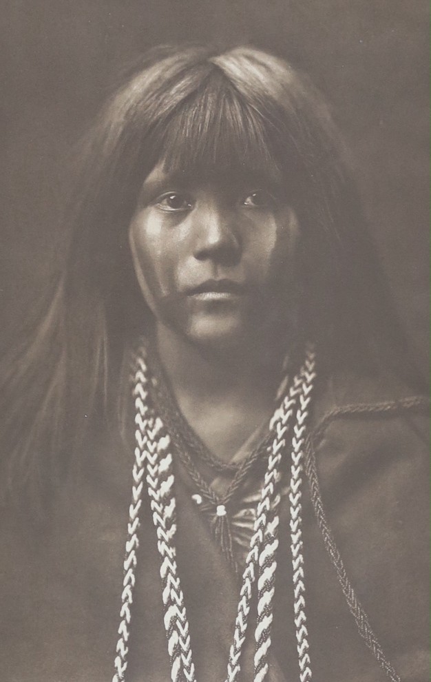 A reprinted black and white photograph of Native American girl, after Curtis, 40 x 25cm